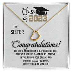 a graduation necklace with a heart on it