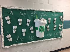 a starbucks sign with cups on it