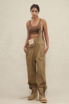 These YPL Overalls Trousers feature an adjustable strap and concealed metal buckle for a customized fit. They also include a side cargo pocket and button closure for added convenience. Get the perfect fit with these comfortable trousers. Overalls One Strap Down, Civilian Outfit, Comfortable Trousers, Buckle Top, People Poses, Yoga Set, Cargo Pocket, Sweater Coats, Bra Tops