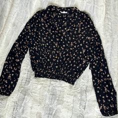 Women’s Button Up Crop Shirt -Black With Pink And White Flowers Size Large Two Faux Breast Pockets Shoulder Buttons Wide Elastic Waist New With Tags Black Collared Top For Spring, Black Collared Top For Fall, Black Collared Top With Floral Print, Black Collared Floral Print Top, Black Floral Print Collared Top, Black Collared Blouse With Floral Print, Black Button-up Tops For Spring, Black Button-up Casual Top, Spring Black Blouse With Buttons