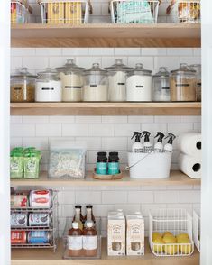 an organized pantry with lots of food and condiments on the shelves in front of them