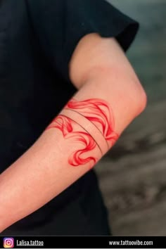 a person with a red tattoo on their arm