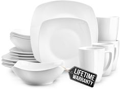 white dishes and cups are stacked on top of each other with a black sign that says, lifetime warrant