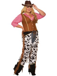 a woman in a cowgirl costume posing for the camera