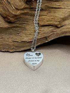 In memory of your mother, mom or loved one who has passed. This heart necklace for mom is a meaningful gift for yourself, family or friends who have lost their mom or a loved one. This pendant can be filled with a small amount of human ashes, dirt from burial site, sand, lock of hair, perfume or oils.  This ash holder is designed to last forever. Free personalized engraving!  Style: Memorial keepsake necklace, openable cremation locket Product description: Includes pendant, chain, elegant velvet bag with one filling kit per order Laser engraving: Mom Always on my mind forever in my heart Material: High grade 316 Stainless Steel urn pendant and chain Color: Silver Measurements: Pendant measures 20mm X 20mm Volume: Inside space 0.05ml  Weight: 0.4oz Screw: Located on top of pendant, airtight Heart Necklace For Mother's Day Memorial, Mother's Day Memorial Heart Necklace With Round Pendant, Heart Pendant Necklace For Mother's Day Memorial, Engraved Heart Necklace For Mother's Day Memorial, Silver Heart Necklace For Mother's Day Memorial, Stainless Steel Keepsake Necklace For Mother's Day, Stainless Steel Necklace For Mother's Day Keepsake, Mother's Day Keepsake Stainless Steel Necklace, Memorial Heart Charm Necklace For Mother's Day