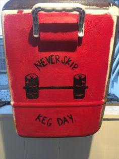 a red suitcase with the words never skip keg day painted on it's side