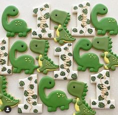 decorated cookies in the shape of dinosaurs