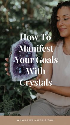 a woman holding a crystal in her hands with the words how to maintain your goals with crystals