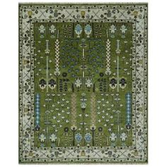 a green rug with blue and white flowers on the bottom, in front of a white background