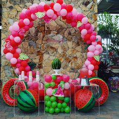 a watermelon themed birthday party with balloons