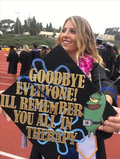 a woman holding up a graduation cap that says goodbye everyone i'll remember you all in therapy