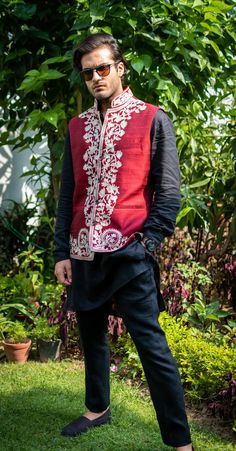 Get the classy and trendy edge with this Nehru Jacket from Angad Creations. This jacket will make you look smart and dapper no matter what you wear it with. Product Details- Condition: Brand New (made to order)- Style: Nehru Jacket- Fabric: Art Raw Silk - Embroidery: Kashmiri Tilla Embroidery- Base Colour of Jacket: Maroon- Embroidery Colour: Dull Gold- Length: 29" (74 cms approx)- Care Instructions: Dry Clean Only.F E A T U R E S- Handmade- Mandarin collar- Sleeveless Design- Three Pockets**If Traditional Nehru Jacket With Embroidered Border, Traditional Nehru Jacket With Floral Embroidery, Traditional Embroidered Art Silk Nehru Jacket, Ceremonial Embroidered Jamawar Nehru Jacket, Festive Red Embroidered Nehru Jacket, Kashmiri Tilla Embroidery, Maroon Embroidery, Tilla Embroidery, Jacket Fabric