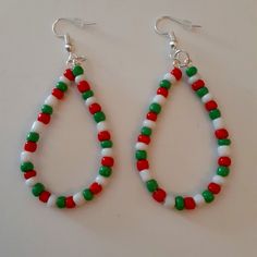 Handmade Red White Green Teardrop Dangle Hoop Seed Bead Earrings Silver Plated French Hook Ear Wires With Clear Rubber Backs To Keep In Place Nickel Free, Hypoallergenic Lightweight Drop Earrings Each Pair Of Earrings Are Ooak And Unique Measures Approximately 2.5 Inch Due To Manufacture Seed Beads Will Vary Yet Each Pair Is Beautifully Handmade By Myself Beads Are Randomly Selected To Create A Unique Pair Each Order Yet Similar And Same Pattern Red, White, Green If You Have Any Questions Please Crochet Santa Hat Earrings, The Grinch Beaded Earrings, Unique Seed Bead Jewelry, Christmas Bead Jewelry, Christmas Beaded Earrings Free Pattern, Bead Crafts Christmas, Christmas Diy Earrings, Christmas Bead Earrings, Seed Bead Earrings Patterns