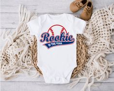 Rookie of The Year, Baseball 1st Birthday Tee Shirt, Boy Loves Baseball Shirt, Our Little Slugger is Turning One Shirt, Baby Shower Gift S/S - Short Sleeves L/S- Long Sleeves Bodysuit Size Chart-In Photos 100% Polyester- Feels Buttery Soft Washing Instructions: Turn garment inside out. Machine wash COLD with mild detergent. NO bleach. Dry at a normal dryer setting on household machines. Do not dry clean. Instructions apply to the material only, please follow garment washing instructions as well."Graphics by OctopusArtis.etsy.com"  Join our Email list for Discounts and Exclusive Offers! https://bit.ly/35otpMQ Rookie Of The Year, Turning One, Birthday Tee, Baseball Shirt, Baseball Shirts, Long Sleeve Bodysuit, Email List, Baby Boy Outfits