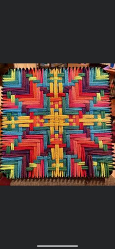 an image of a multicolored quilt with text overlay that reads, the art of crochet