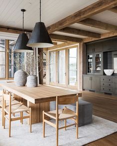 the instagram page shows an image of a dining room with wooden furniture and large windows