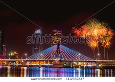 fireworks on the bridge and buildings in the background