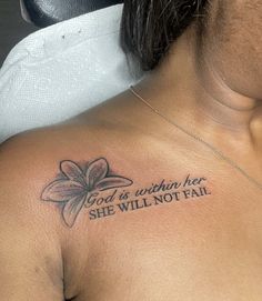 a woman with a tattoo on her chest saying god is worth her she will not fail