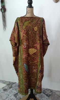 This caftan tunic will become one of your favorite pieces! African fabric print multicolored burgundy, green, blue 100% Cotton Wax Print Fabric Without lining The cut of the tunic is straight and wide with the sleeve above the elbow. Width of neckline approx 30-32cm Rounded boat neckline or V-neckline as per your choice Tunic measurements 100cm wide and 114cm long If you need other measurements, write to us! Traditional Long Multicolor Tunic, Green Tunic Kaftan For Festivals, Bohemian Style Long Brown Thobe, Bohemian Style Brown Long Thobe, Brown Bohemian Long Thobe, Long Multicolor Batik Print Kaftan, Long Multicolor Kaftan With Batik Print, Multicolor Tunic Thobe For Festivals, Green Traditional Kaftan With Kimono Sleeves