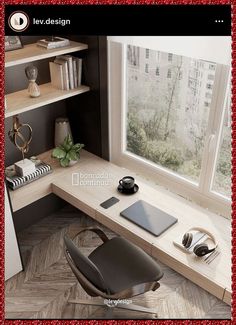 a computer desk with headphones and a laptop on it next to a large window