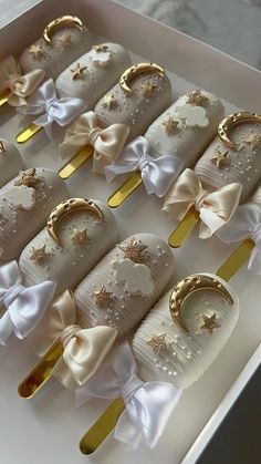 a box filled with gold and white decorated items