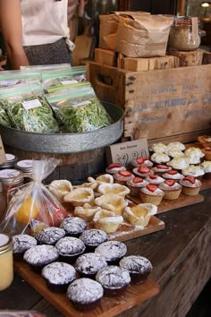 an assortment of pastries on display at a market