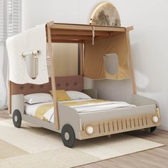 a child's bed with a tent on top