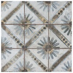 an artistic tile design with blue and gray flowers on the bottom, in square tiles