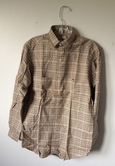 "vintage 80s check shirt  NEW OLD STOCK Vintage mens button front shirt,  small 2 1/2\"  collar,  box pleat on back, chest pockets, shirt tail hem      LABEL -  NEIMAN-MARCUS       MADE in HONG KONG             100% cotton      plum, brown, beige, and blue  check weave             CONDITION -  NOS  NEW-OLD-STOCK  DEADSTOCK      EXCELLENT       SIZE   S  chest (side - side ) 21\" across back shoulders 17\" sleeve length - 33\" (24\" from shoulder)   length (back neck to hem) 31\"" Plaid Button-up Shirt With Welt Pockets, Unstructured Brown Collared Shirt, Fitted Collared Flannel Shirt For Workwear, Classic Plaid Shirt With Welt Pockets, Vintage Unstructured Shirt For Workwear, Vintage Fall Shirt With Placket, Classic Fitted Collared Flannel Shirt, Unstructured Vintage Shirt For Work, Retro Brown Workwear Shirt