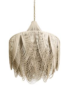 a white chandelier hanging from a chain with fringes on the bottom and sides