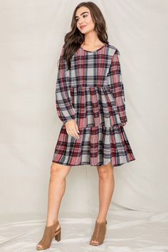 Made in the USA 95% Polyester 5% Spandex Elastic waistband, long sleeves with elastic, tiered skirt Size: 1X(18), 2X(20), 3X(22) 1X: Bust 44" Length 38" 2X: Bust 46" Length 38.5" 3X: Bust 48" Length 39" Fall Long Sleeve Dresses With Ruffle Hem, Long Sleeve Plaid Dress With Ruffle Hem, Long Sleeve Ruffle Hem Fall Dresses, Long Sleeve Ruffle Hem Dresses For Fall, Casual Long Sleeve Tiered Dress With Ruffles, Fall Dresses With Ruffle Hem And Tiered Shape, Long Sleeve Dresses With Ruffle Hem For Fall, Red Long Sleeve Dress With Ruffle Hem, Casual Tiered Dress For Fall