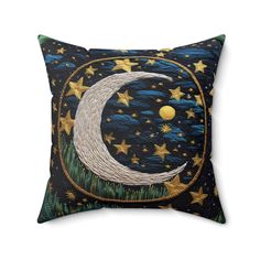 a pillow with the moon and stars on it