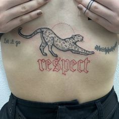 a woman with a tattoo on her stomach has the word respect written in red ink