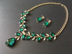 "** This listing comes with a necklace together with a pair of matching studs at back design earrings. ** Featuring clear rhinestones crystals and green glass stones and finished with gold plated cable chain. Just lovely and romantic!! Color: gold plated with clear rhinestone crystals and green glass stones Size: necklace measures around 19.25\" long x 3\" drop and earrings around 1.25\" long x 0.4\" width ** Please note we need to take around 5 days to make it. Please be patient. ** Item ship o Green Crystal Emerald Necklace For Wedding, Green Crystal Jewelry Sets With Jewels, Green Crystal Rhinestone Necklace For Wedding, Elegant Gold-plated Green Bridal Necklace, Elegant Green Gold-plated Jewelry Sets, Elegant Green Rhinestone Jewelry Sets, Green Crystal Jewelry Sets With Rhinestones, Green Crystal Rhinestone Jewelry Sets, Green Crystal Necklace With Hand-set Details