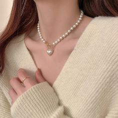 ✦ A must-have accessory for any fashionista, the Mermaid Pearl Beaded hEART cHARM Necklace is sure to add some sparkle and sophistication to your look. With its dainty and special design, this stunning piece will make a statement wherever you go. Get ready to turn heads and make hearts skip a beat when you wear this beautiful necklace! Luxurious, elegant, and timeless! ----------- DESCRIPTIONS ------------ Size (Length): 39.5cm- Color: White, Gold- Materials: Alloy, Mermaid Pearl, Rhinestone- SK How To Wear Pearls Casual, Downtown Girl Jewelry, Y2k Cutecore, How To Wear Pearls, Mermaid Pearl, Pearl Love, Beaded Heart, Coquette Y2k, Heart Charm Necklace