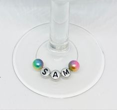 two balls are sitting on the bottom of a wine glass that says,'i am 3 '