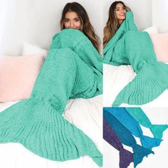 a woman laying on top of a bed covered in a mermaid tail blanket and under the covers