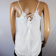 White Naked Zebra Spring Top White Tank Top With Adjustable Straps For Night Out, White Camisole With Straps For Night Out, White Backless Tank Top With Straps, Backless White Tank Top With Straps, White Strappy Tops For Brunch, White Strapped Tops For Brunch, White Strappy Top With Crisscross Straps, White Strappy Tank Top With Built-in Bra, Spring Tops