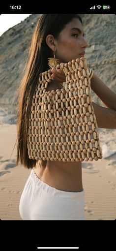 Our wooden beaded bag looks so chic carried against any outfit and is just as suited for vacation or days in the city. Made from wooden beaed, it's unlined or lined and has sturdy top handles. Made from order Hane Atelier We can change size and colour Thanks to so much for stopping by our shop Please contact me if you have any problems with your order. Beaded Shoulder Bag, Beads Bag, Handmade Fabric Bags, Beaded Clutch Bag, Wooden Bag, Embroidery Bags, Vintage Beads, Beaded Bag, Macrame Bag