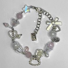 a bracelet with charms and other items on it