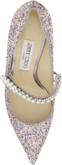 Elevate your style with these dazzling pumps that exude glamour and sophistication. Crafted with glitter and adorned with a Swarovski crystal strap, these pumps by Jimmy Choo are a show-stopping addition to your wardrobe. The leather lining and insole with logo label ensure comfort and quality, while the glittered heel and leather sole add a luxurious touch to these statement shoes. Make a stunning entrance at any event or night out with these BING 65 pumps. Whether paired with a cocktail dress Jimmy Choo Bing, Glitter Heels, Statement Shoe, Heel Mules, Sparkles Glitter, Crystal Embellishment, Mid Heel, Stacked Heel, Stiletto Heel