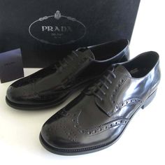 Men's Polished Leather Prada ( Style: 2ee 061 ) Dress Shoes With Rounded Wing-Tip Toe, Perforated Trim Details Throughout, Toe Medallion, Five Eyelets Lace-Up Vamp, Detailed Tonal Stitching, Leather Lining/Insole, Rubber Sole And Leather/Rubber Heel. Color: Nero Or Black ( See The Pictures ). Size: 6 1/2 ( Prada ) Or 7 1/2 ( Us ). Made In Italy. Condition: Brand New. Includes Original Prada Box, Two Dust Bags And Care Card. Eyelet Lace, Trim Detail, Rubber Heels, Derby, Oxford, Prada, Dust Bag, Dress Shoes, Men's Shoes