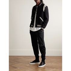 Balmain's sweatpants are detailed with a reflective embossed logo, so they'll look especially cool at night. They're cut for a slim-tapered fit from cotton-jersey. Wear them with the matching hoodie or one of the label's printed tees. Small to size. See Size & Fit notes. Urban Black Sweatpants With Ribbed Cuffs, Sporty Streetwear Pants With Ribbed Cuffs, Sporty Pants With Ribbed Cuffs For Streetwear, Sporty Joggers With Ribbed Cuffs For Streetwear, Urban Joggers With Ribbed Cuffs For Streetwear, Sporty Streetwear Bottoms With Logo Detail, Athleisure Tracksuit With Ribbed Waistband For Streetwear, Black Sports Sweatpants With Logo Detail, Black Logo Detail Sweatpants For Sports