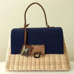 Nwt Beautiful Kontessa Made In Italy Hand Woven Wicker Straw Bag. Looks Similar To The Hermes Picnic Bag. Rigid Structure Of Intricate Handwoven Wicker, With Navy Blue Canvas Flap, And Gold Tone Hardware With Real Wood Panel Accent On The Opening Hardware. Opens To A Roomy Fabric Lined Interior With A Zipper Pocket. Comes With Adjustable Shoulder Strap And Dust Bag. Bag Is Shaped Like A Trapezoid, Dimensions Are 15x9x5 Inches (Widest Base X Height X Width) Orange Purse, Louis Vuitton Papillon, Straw Handbags, Leather Travel Bag, Picnic Bag, Black Leather Purse, Blue Canvas, Leather Travel, Wood Panel