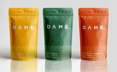 three different types of coffee bags with the same logo on each bag, one in orange and one in green