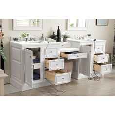 a bathroom vanity with two sinks and drawers