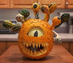 an orange pumpkin decorated to look like a monster