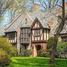 an old style house with stone and wood trim