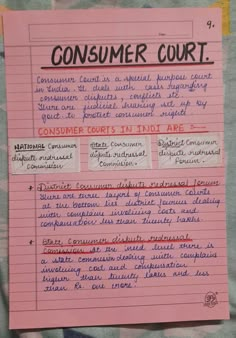 a pink piece of paper with writing on it that says consumer court, consumer courts in india