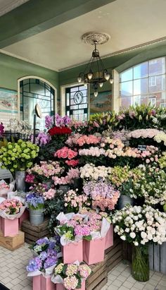 a flower shop filled with lots of different types of flowers